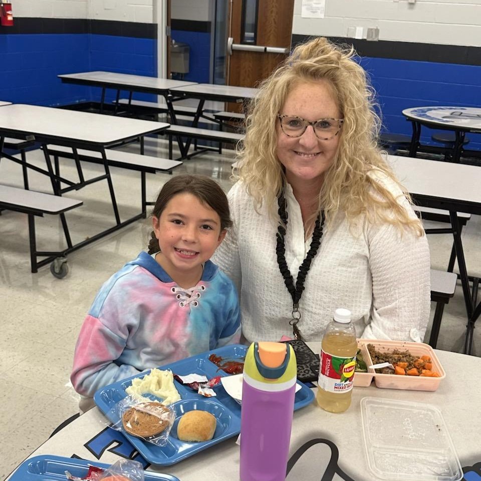 Teacher and students eat lunch