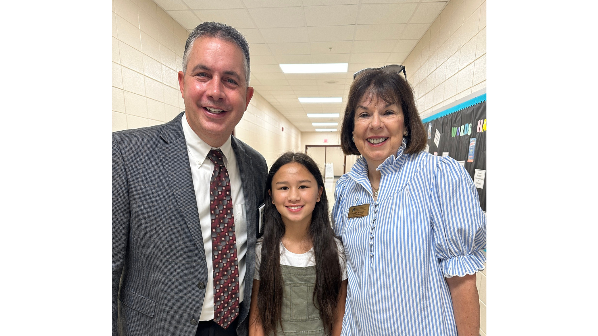 Dr. Rogers with student and BOE chair