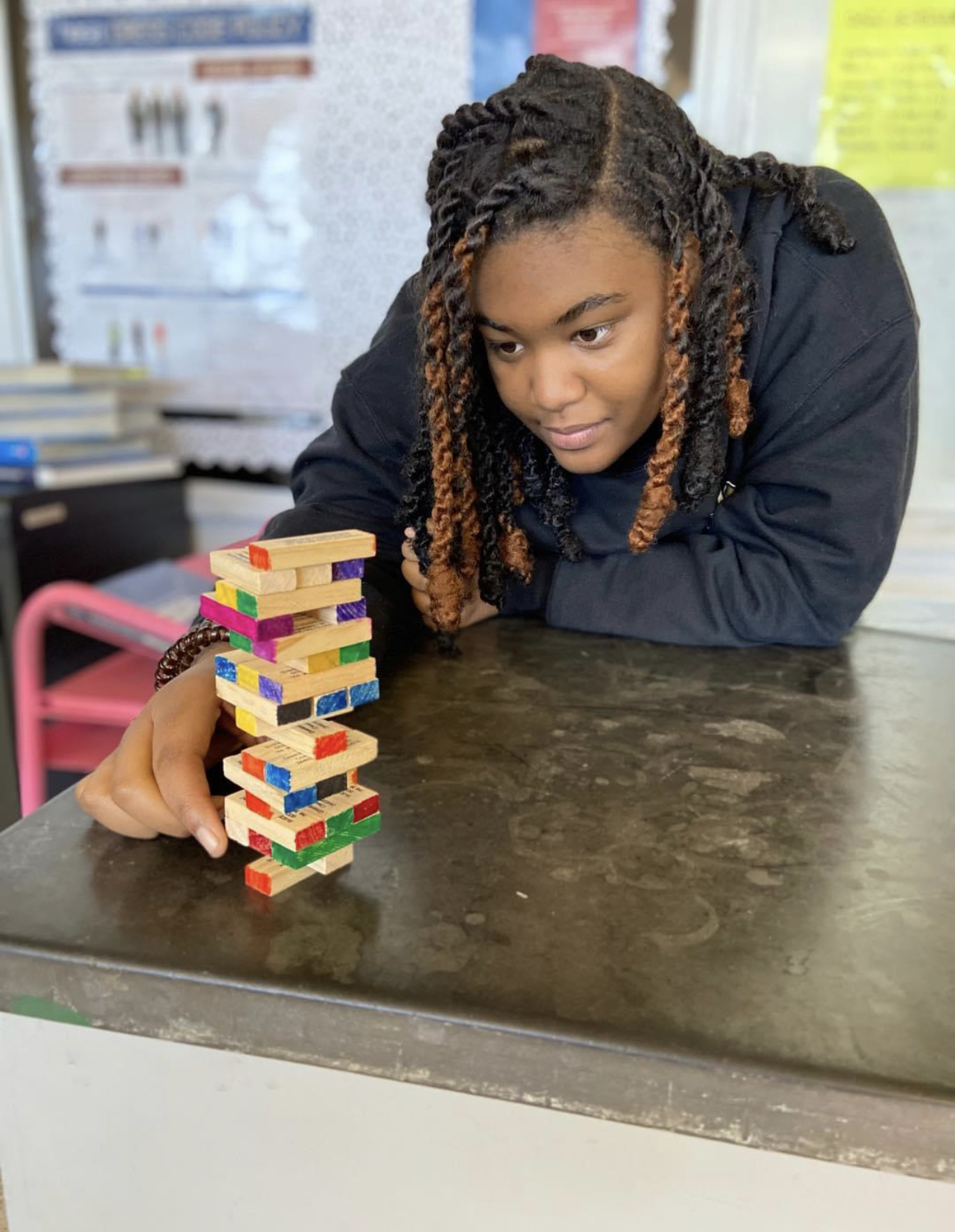 A LHS student participate in vocabulary Jenga. 