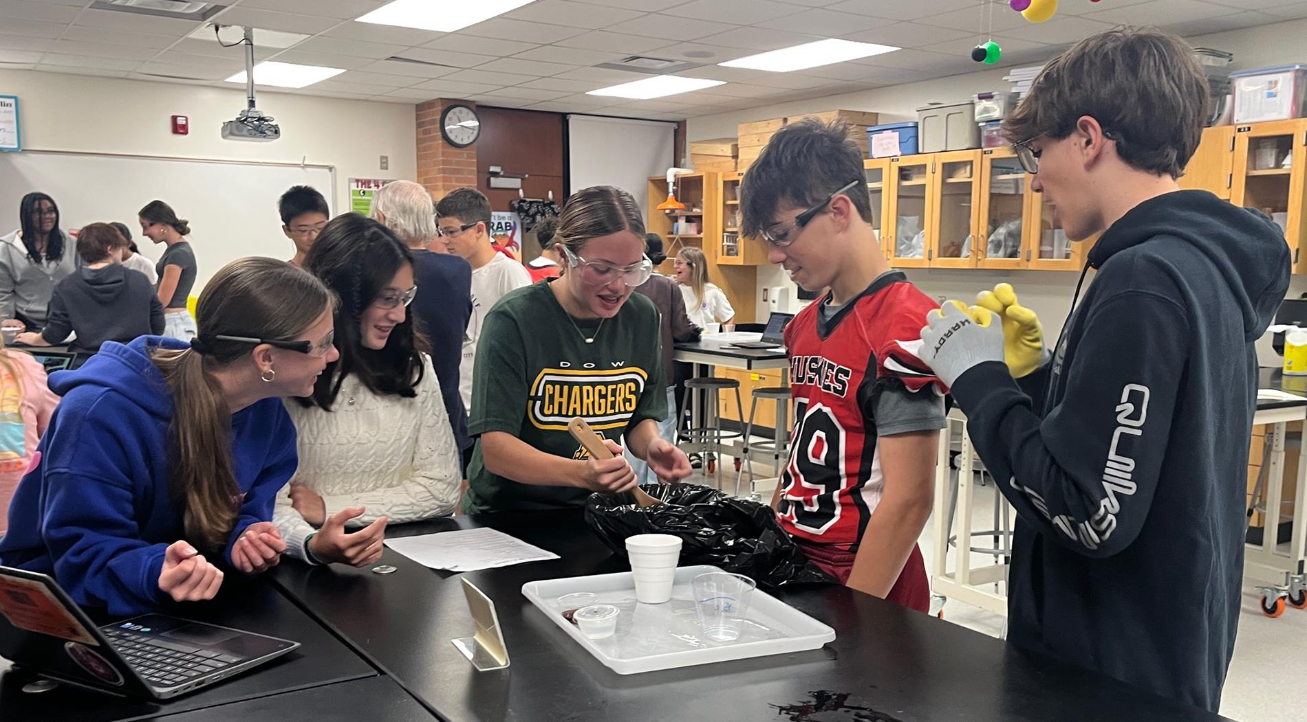 A group of middle school students in a lab