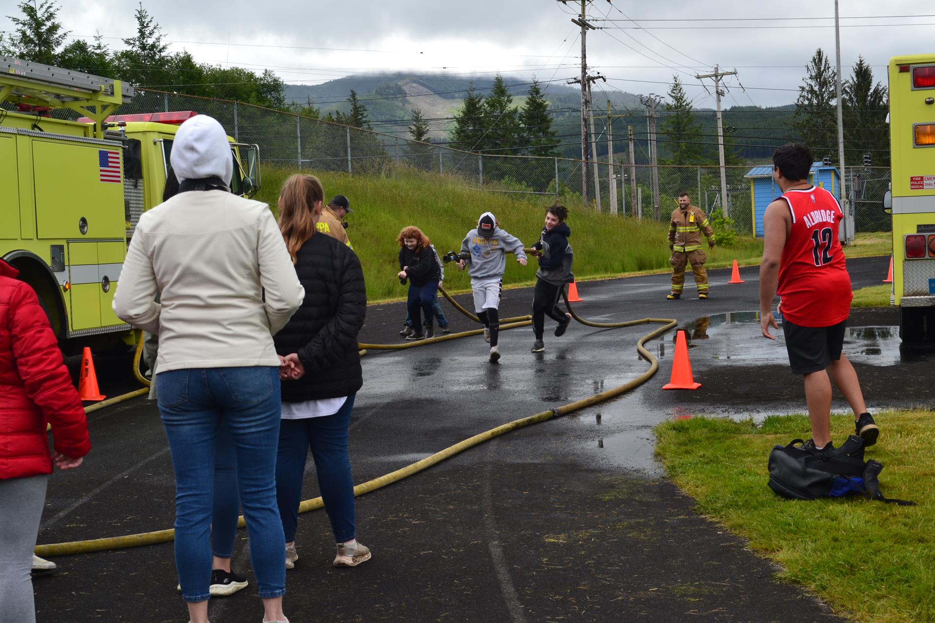 5th graders participating in the fire hose relay