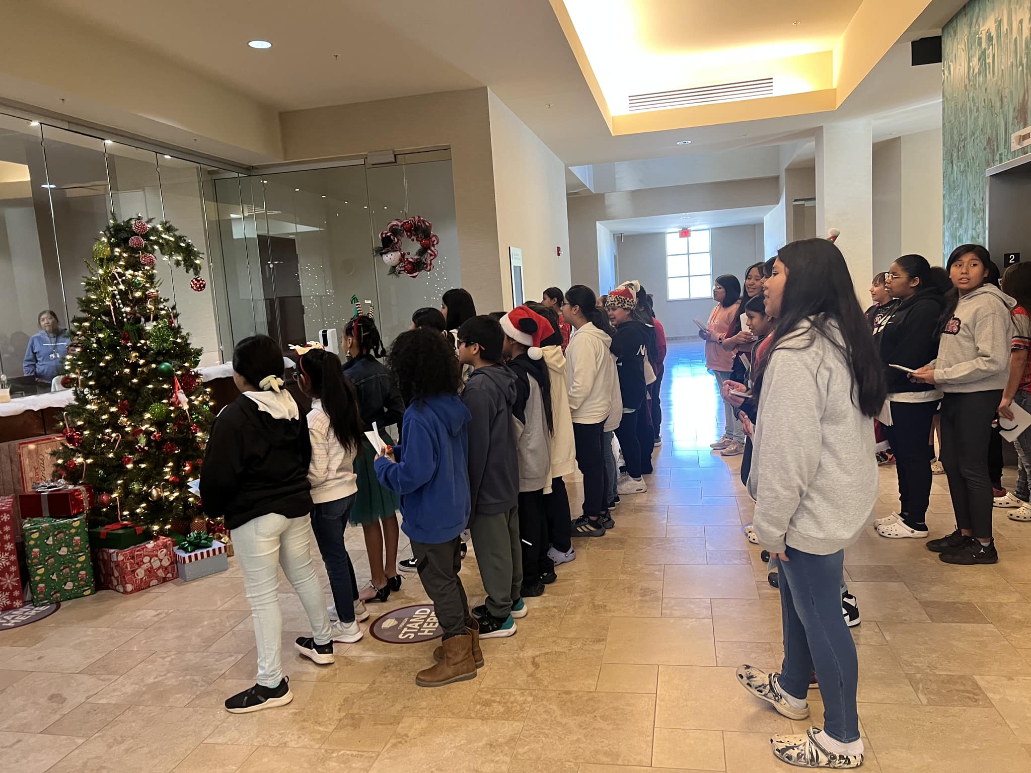 Dec 2023 Jr. Beta students caroling at the Justice Complex and the Fire Department