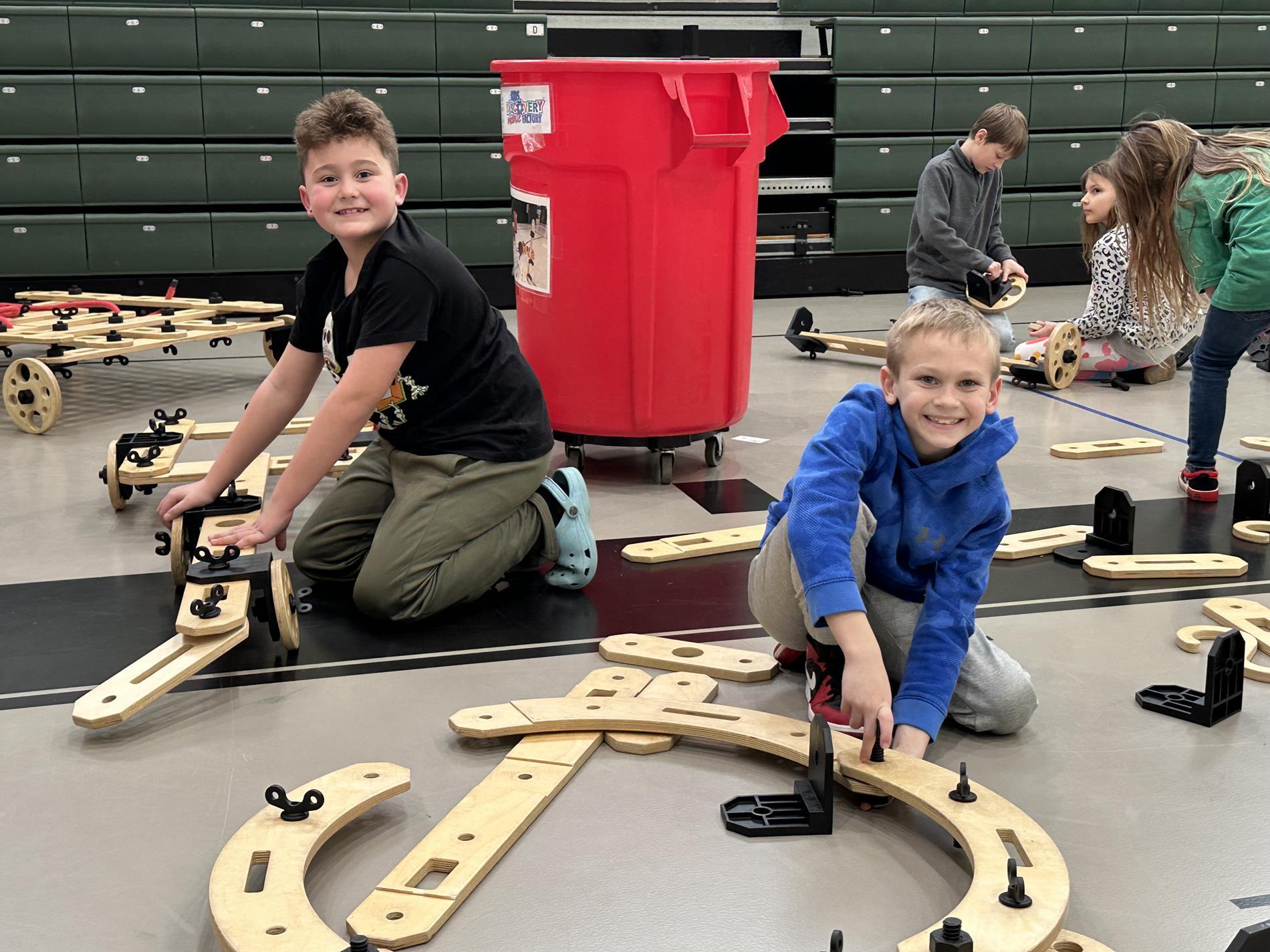 Two elementary boys working on a STEM project.