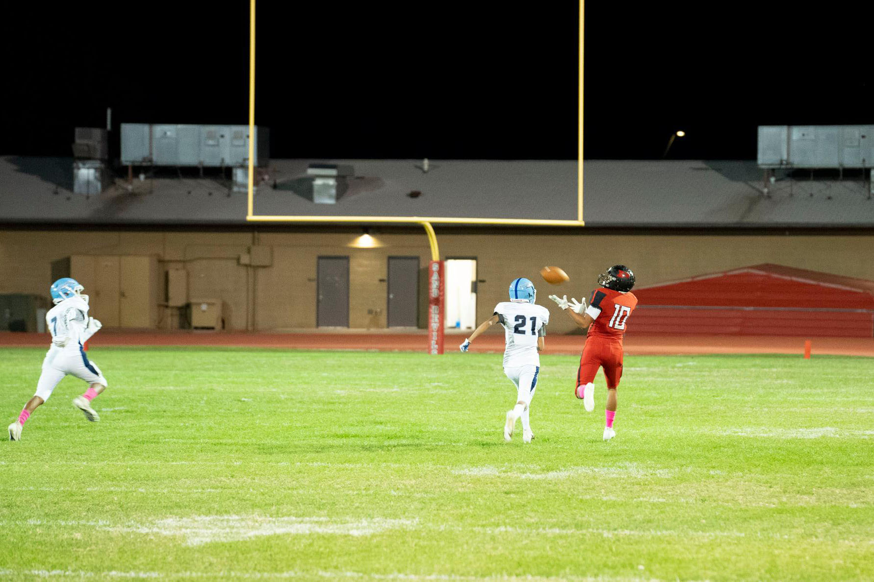 football player catching a pass football player catching a pass