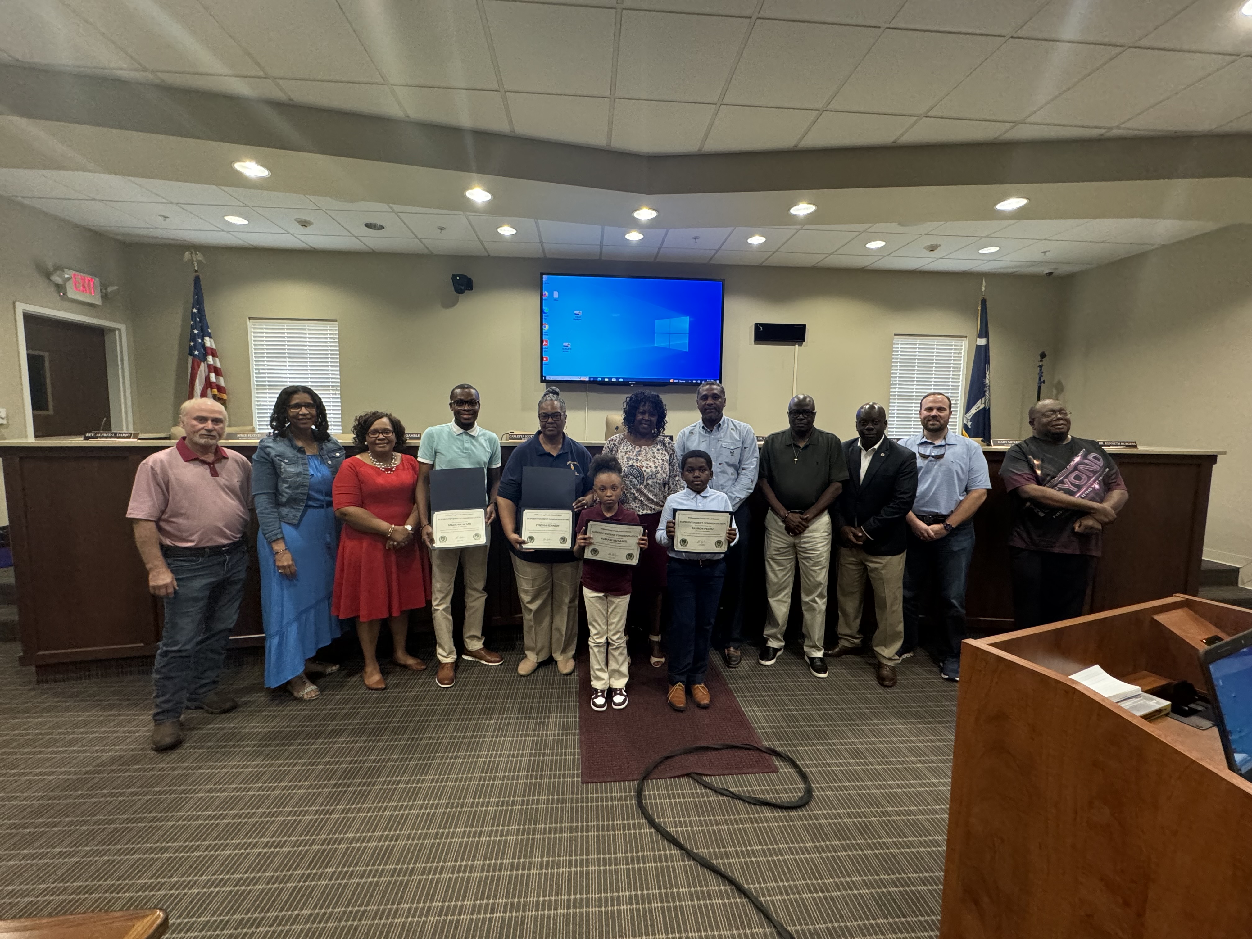 students recognized for their academic achievement. pictured along with school board members 