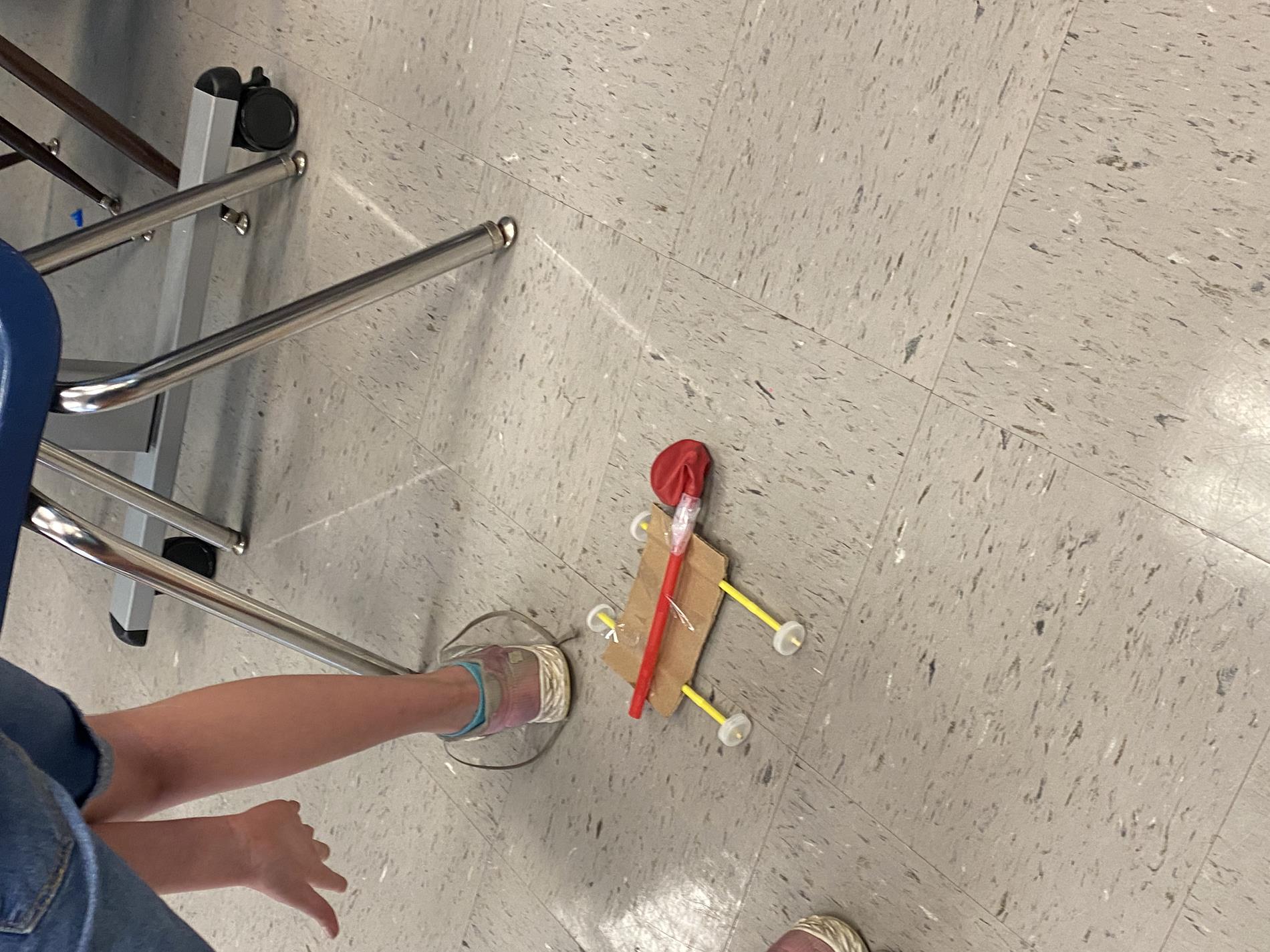 Students trying out their air powered cars.