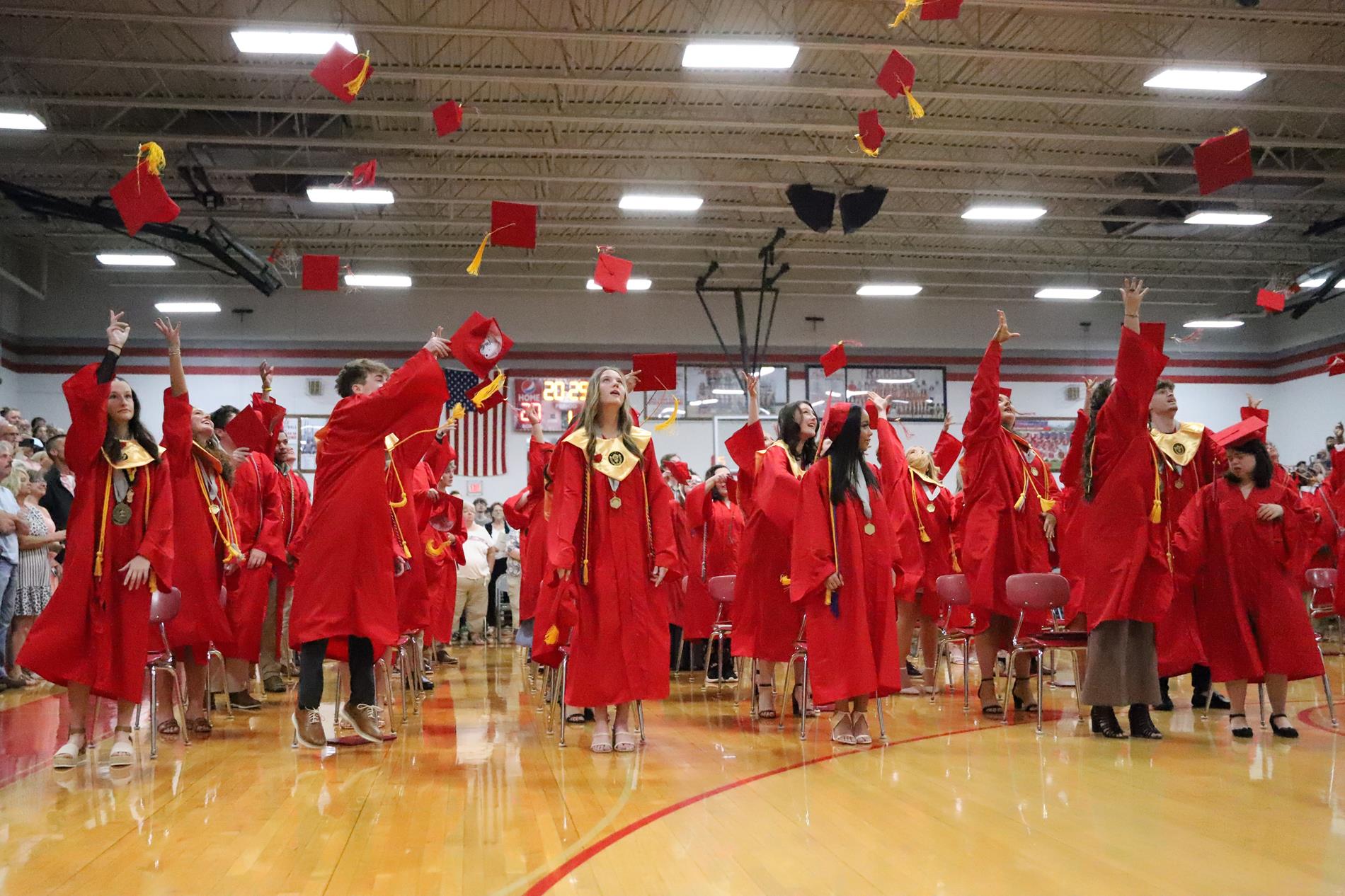 Grads throwing Caps