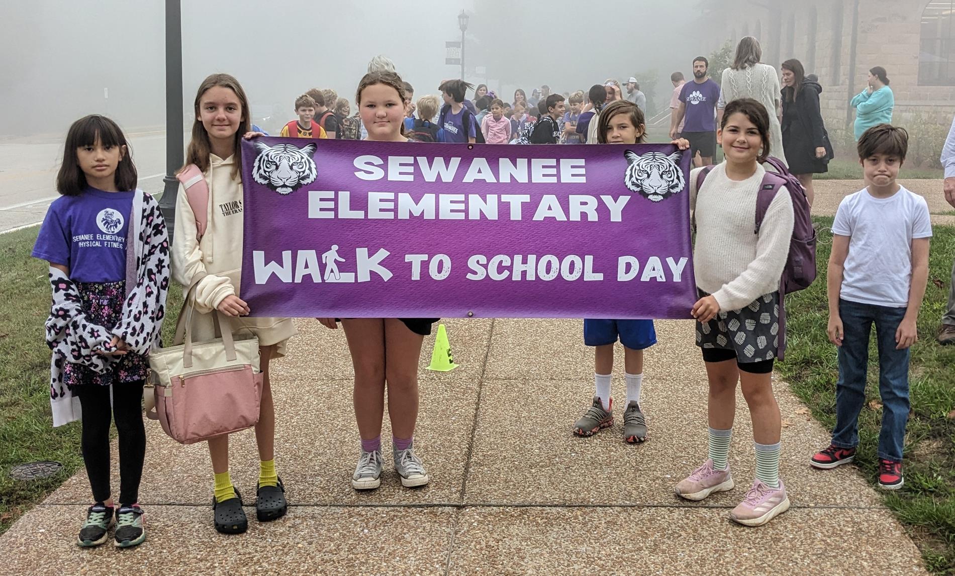 students holding a banner