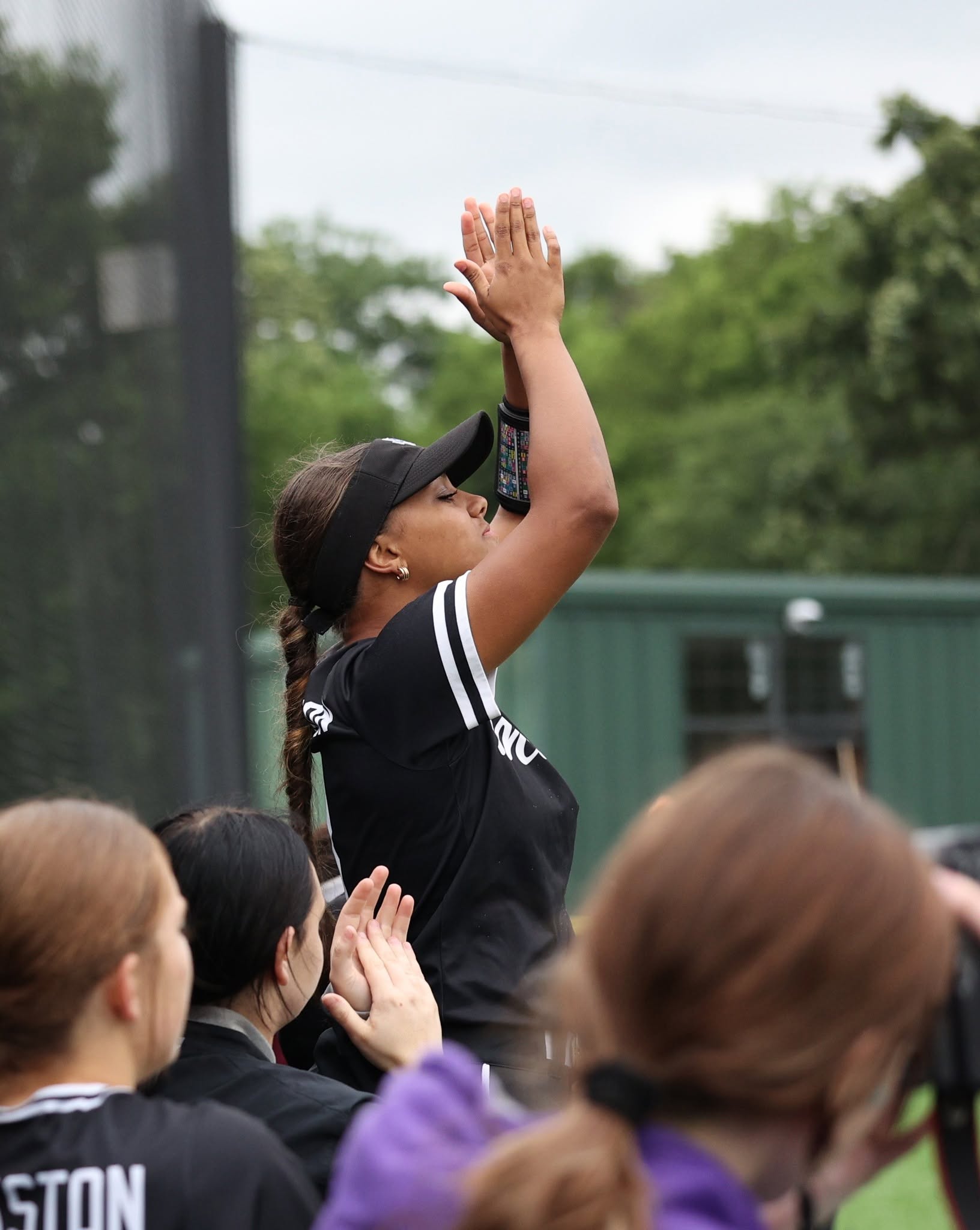 softball player cheering for her team