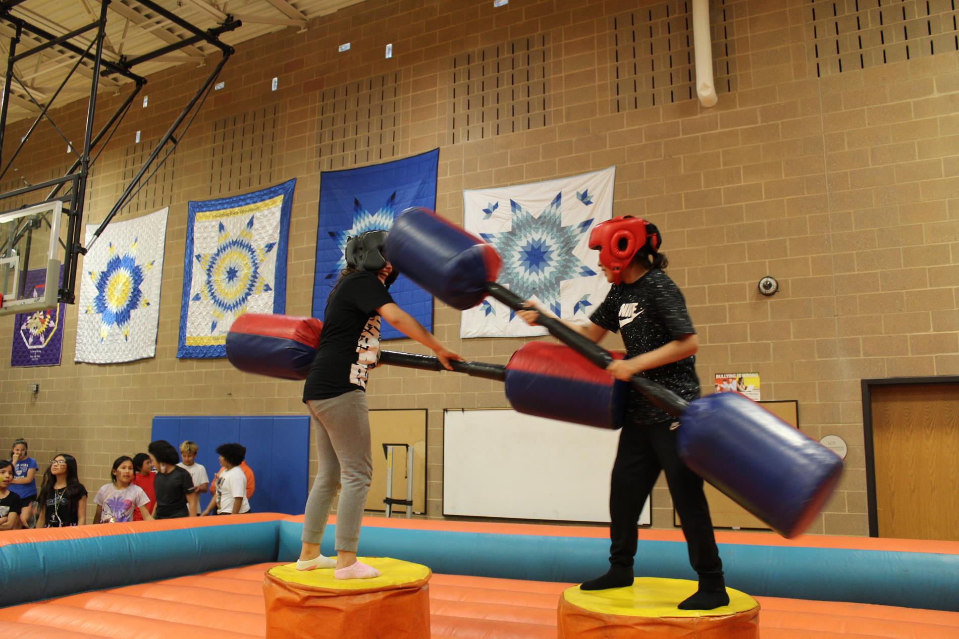 2 student having a good time jousting