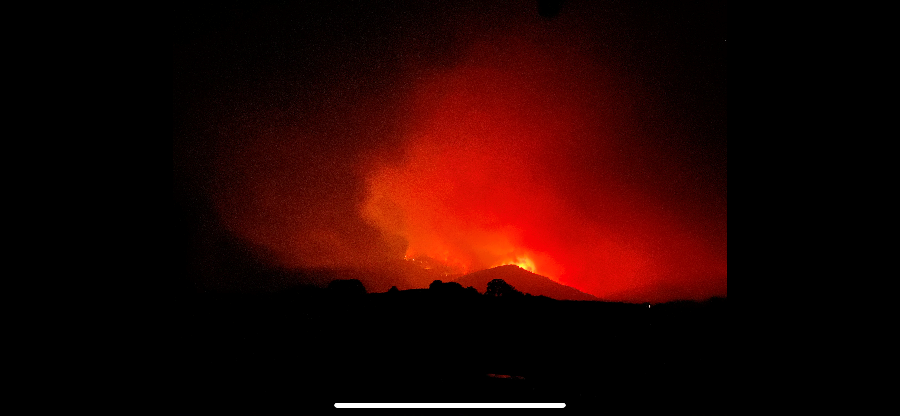 Photo By: Arynne Gregory March 17, 2022 - night photo of a fire over the hill