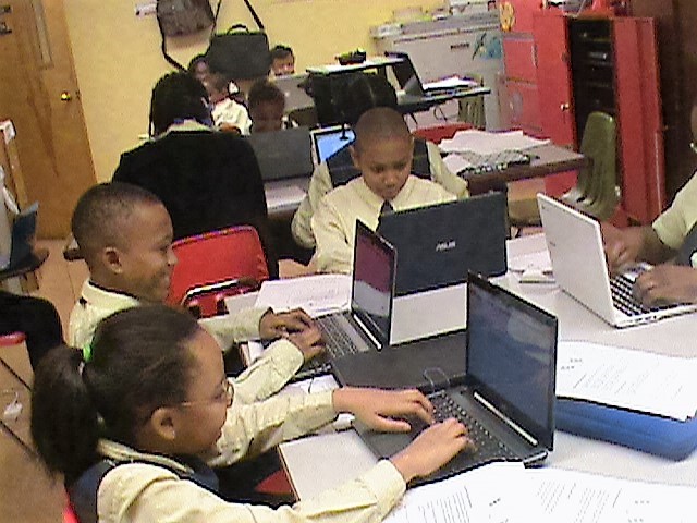 children at computers working