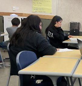 Middle school students working in class