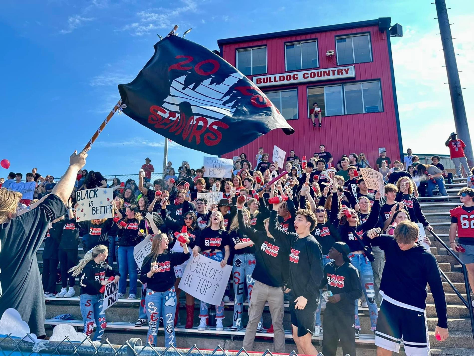 Senior class during pep rally with flag