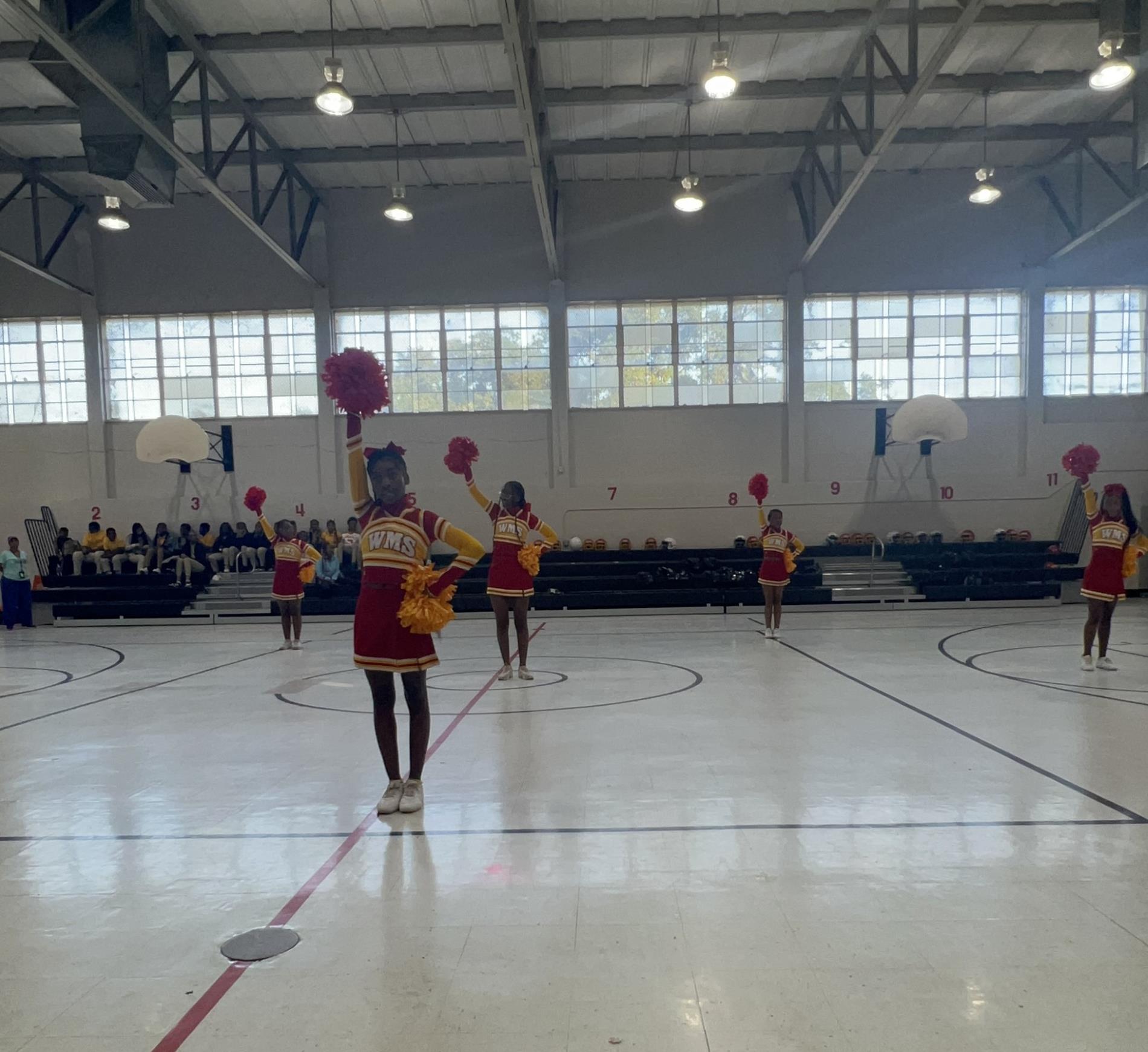 Cheerleaders cheering