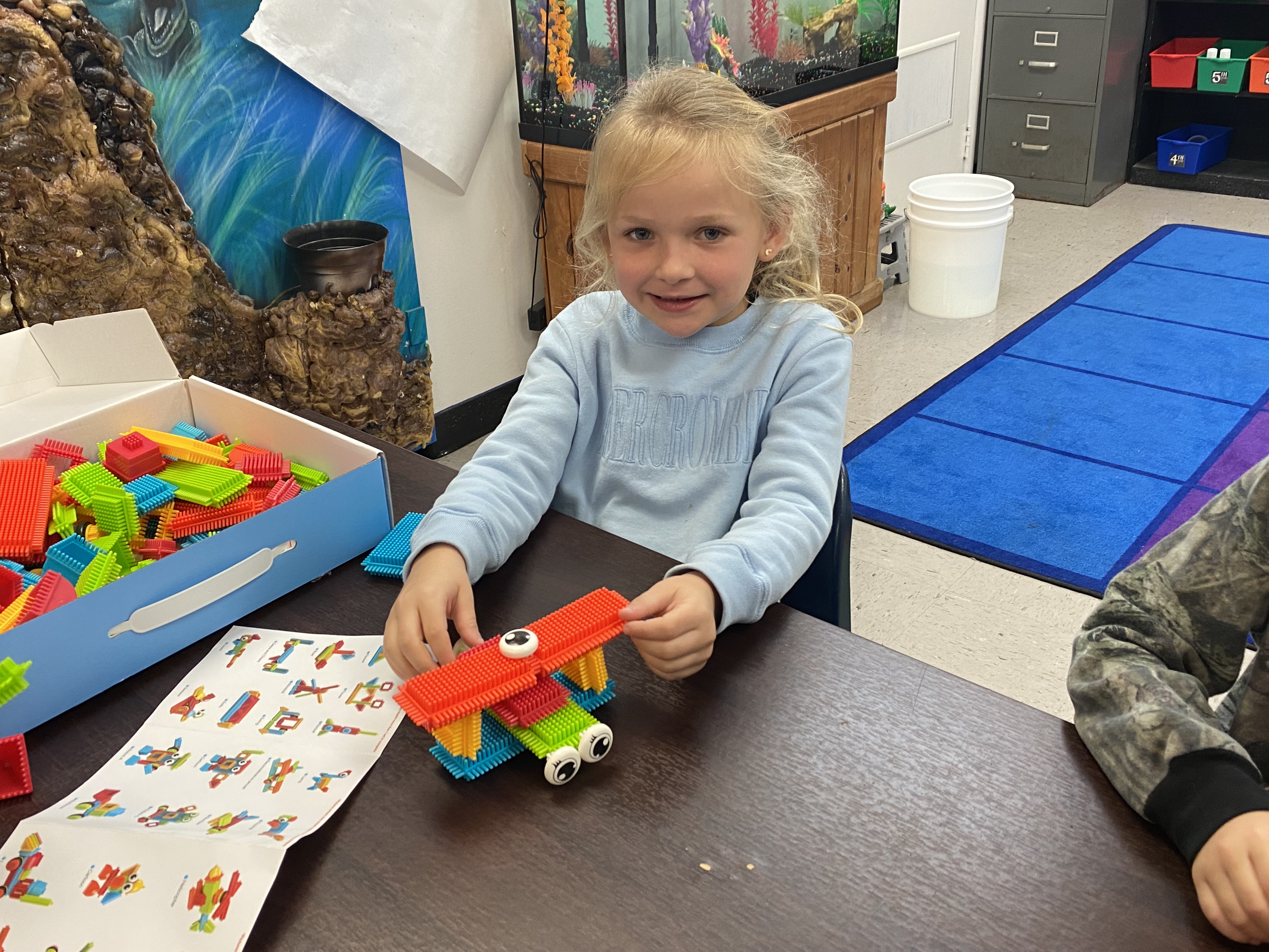 Kindergarten students exploring how to be an engineer with Bristle toys.