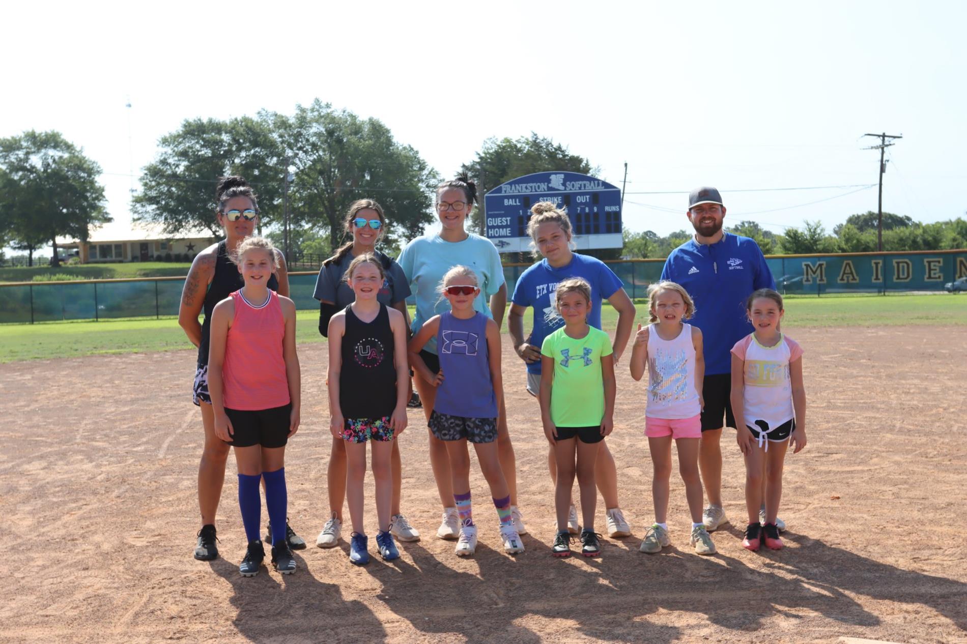 Softball camp group with coaches