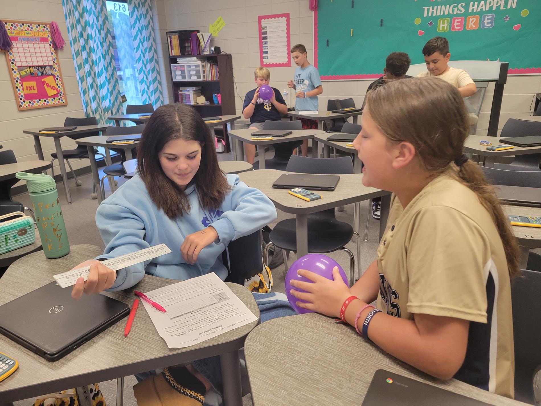 Students in Mrs. Todd's class work on a science experiment. 