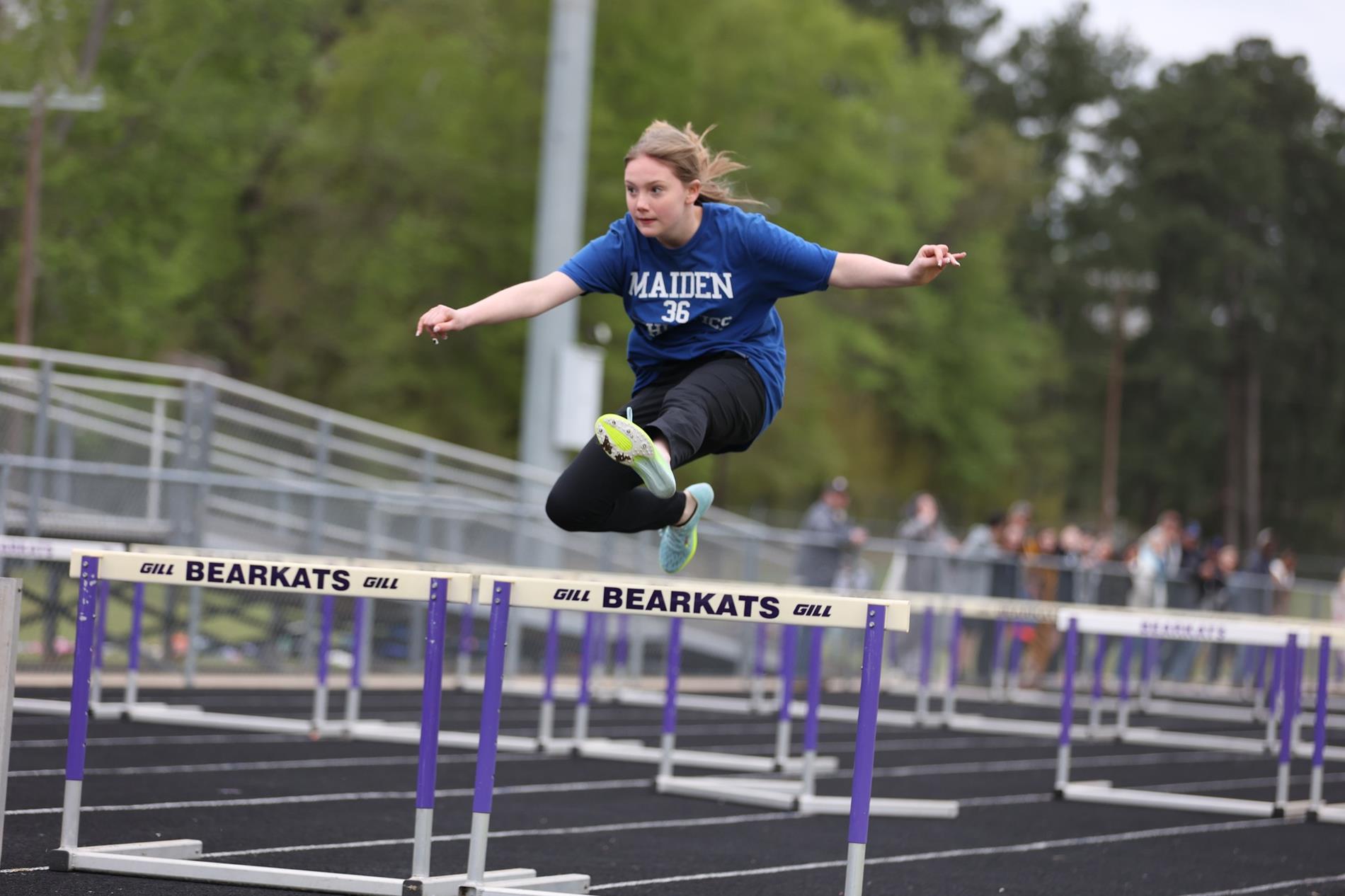 Student running track