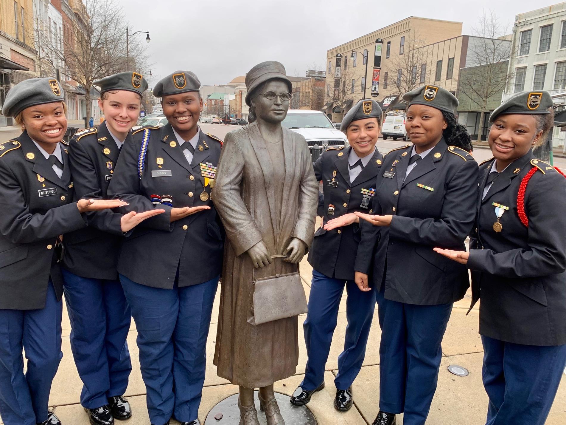Murphy and Blount JROTC female cadets pose with the Rosa Parks Memorial Bust on Dexter Avenue in Montgomery, Alabama.
