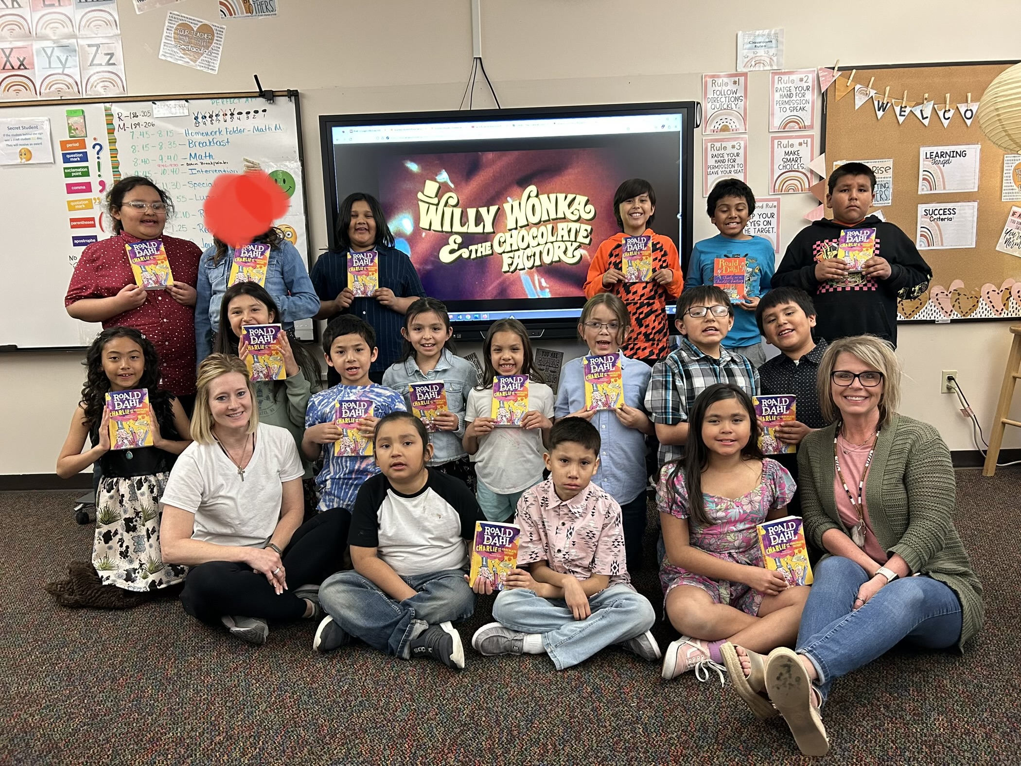 2nd grade Night Lights students with their teachers holding golden tickets