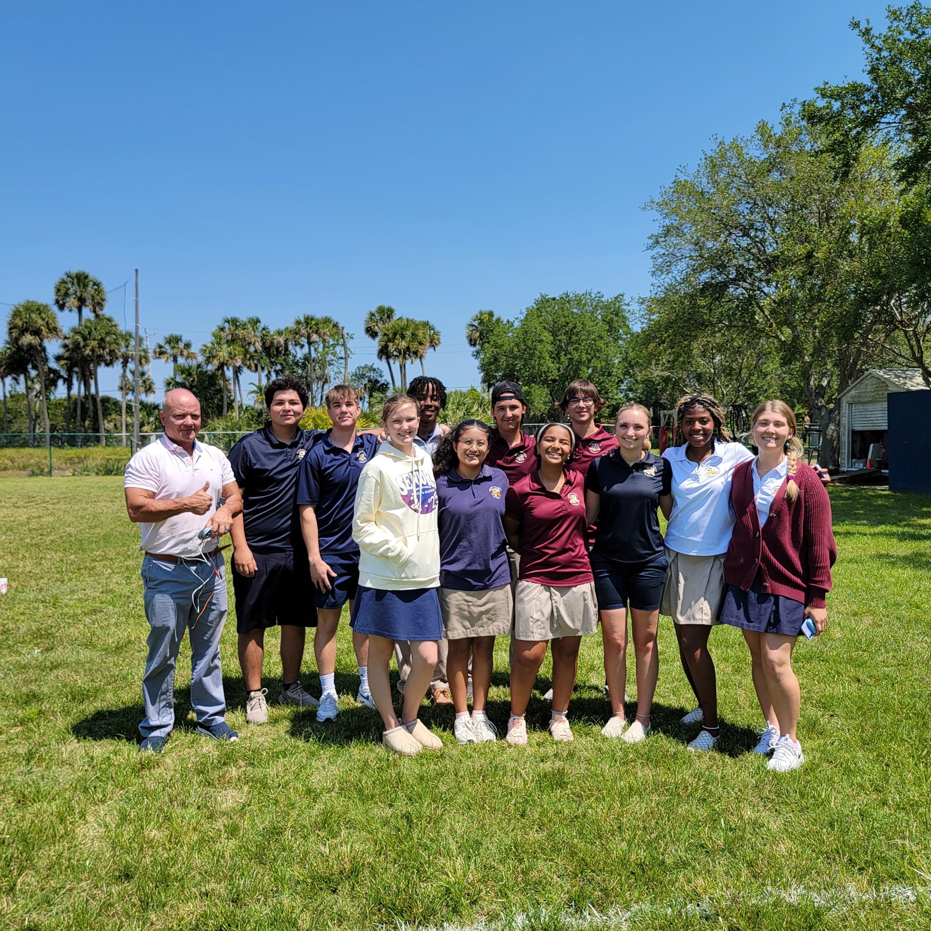 STEM students posing after rocket launch