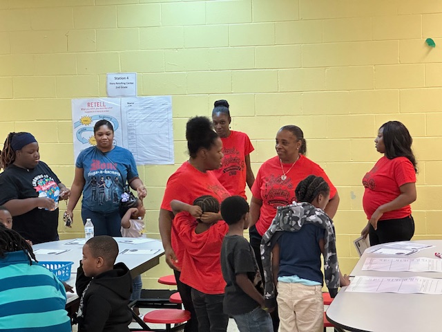 Teachers and Parents conversing at literacy night.