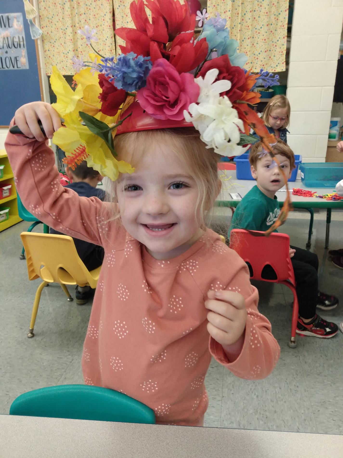 little girl wearing flower hat