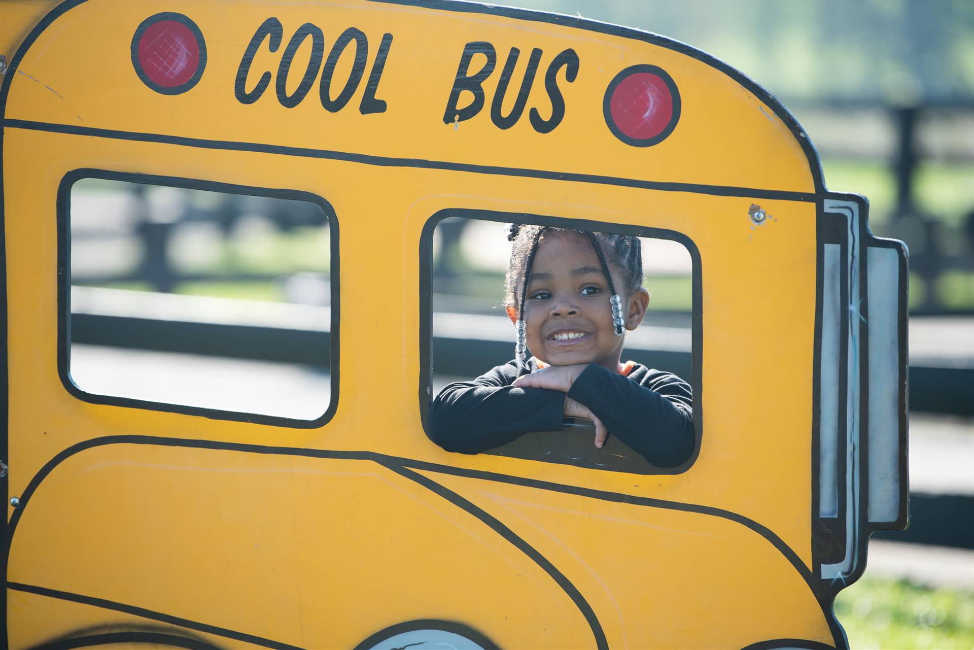 child looking through bus window