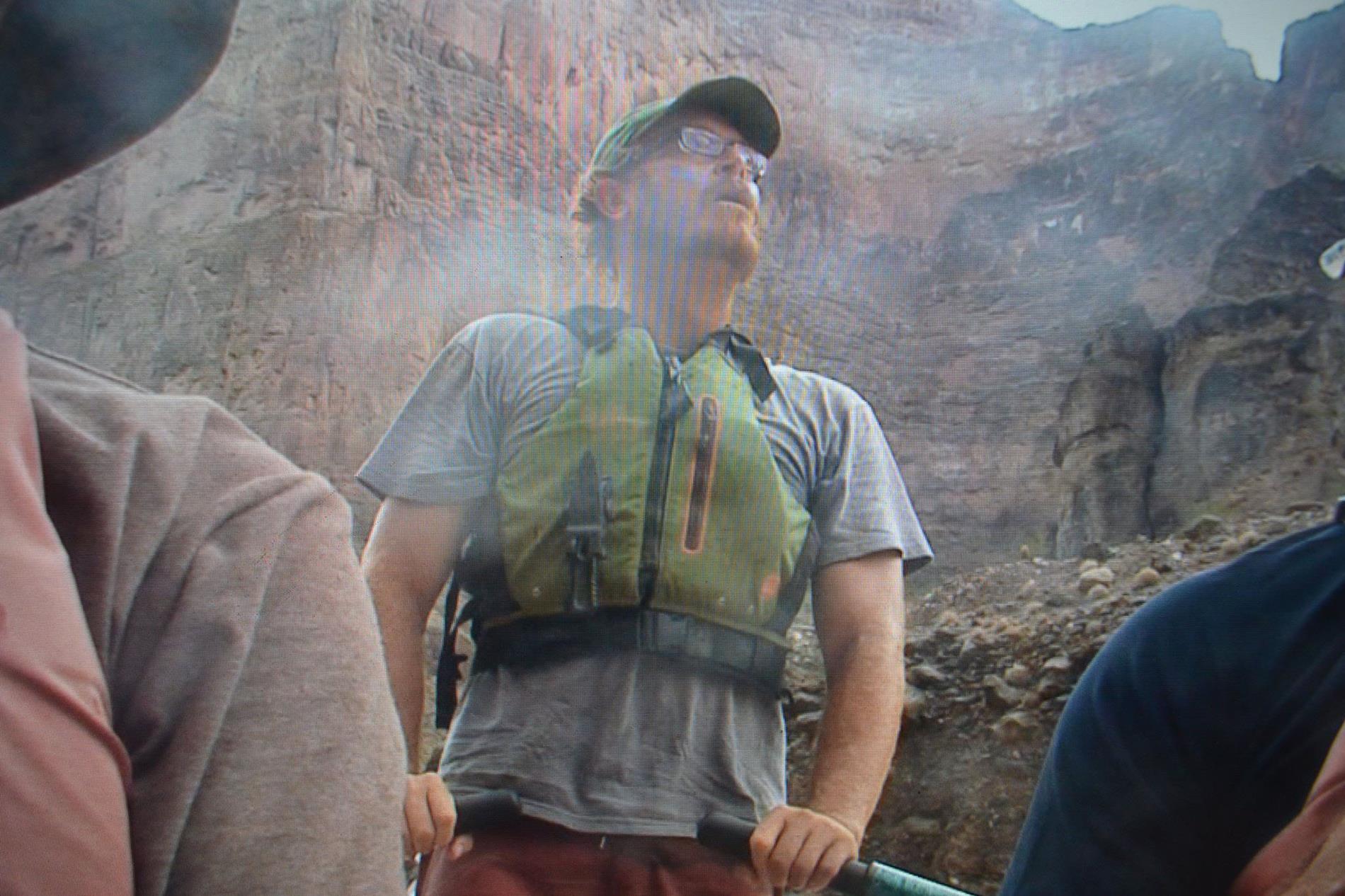 Steven piloting a raft in the Grand Canyon