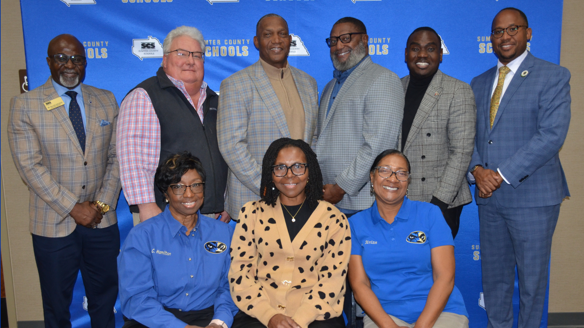 Picture of Sumter County School Board Members, Superintendent, and Associate Superintendent. Seated from left to right, Mrs. Carolyn Hamilton, Ms. Abbis Bivins, Mrs. Patricia Harris. Standing from left to right: Mr. Walter Knighton, Mr. Rick Barnes, Mr. Dwight Harris, Mr. Vincent Kearse, Mr. Edward Jackson, Mr. Jerry Sanders