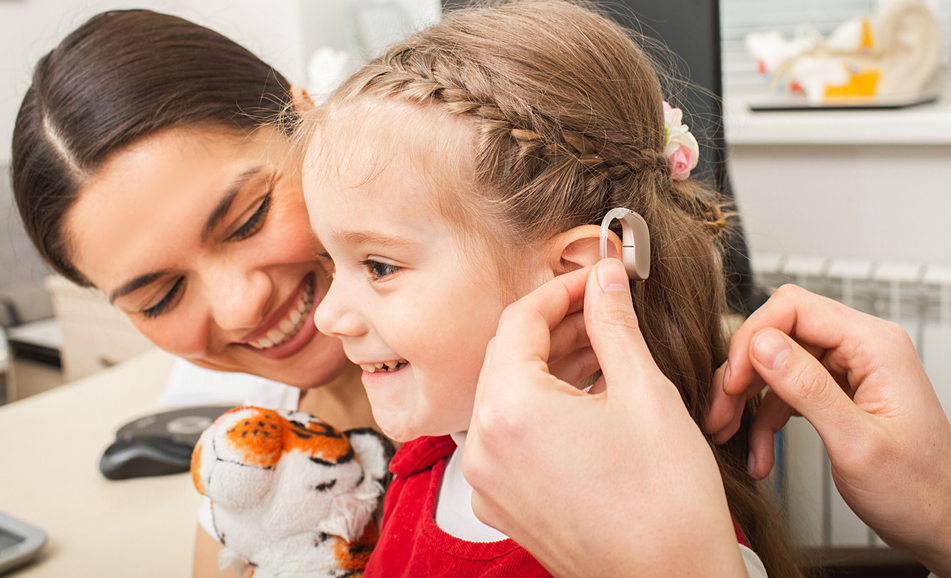 girl getting hearing aids