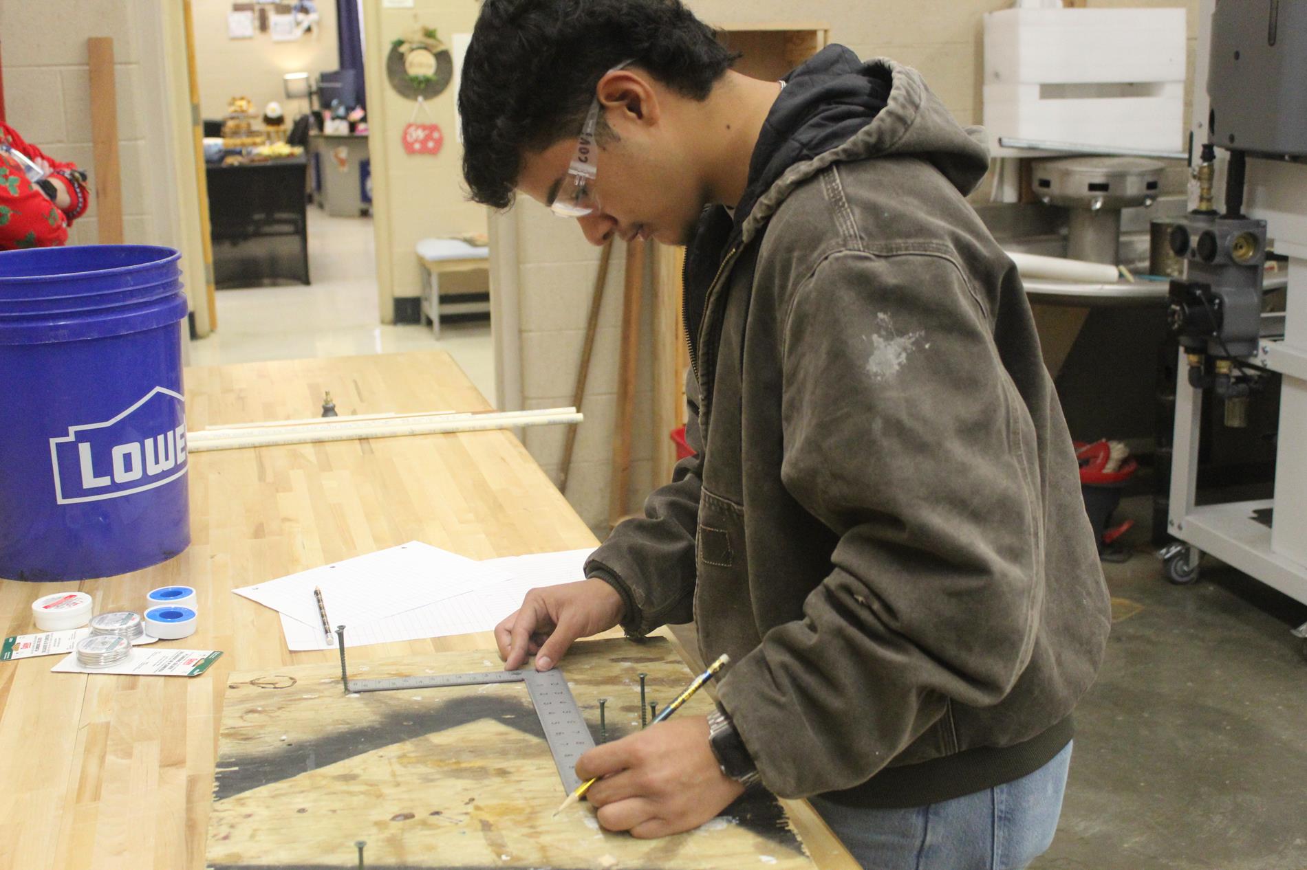 student working in shop class
