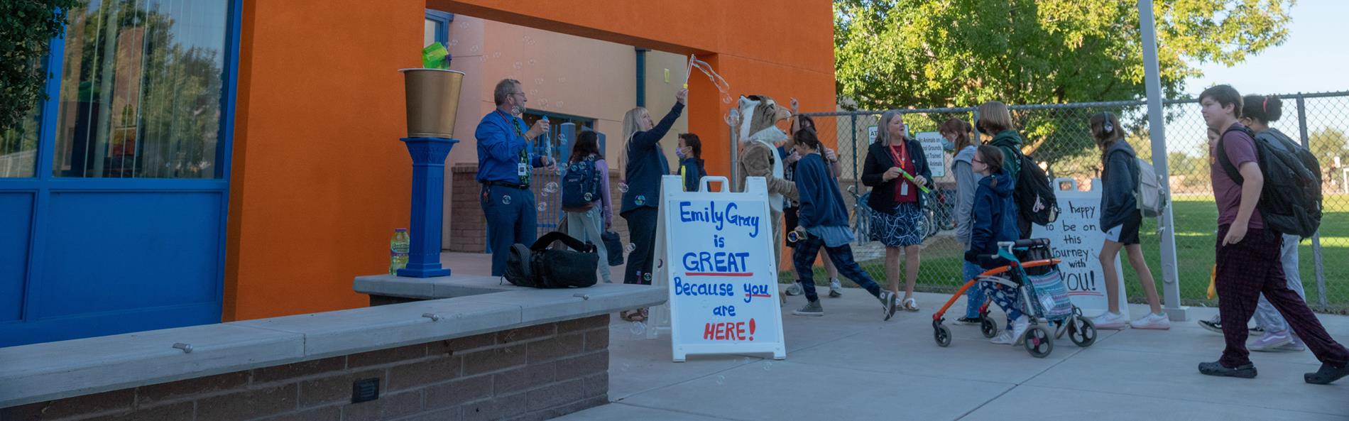 greeting students at school entrance