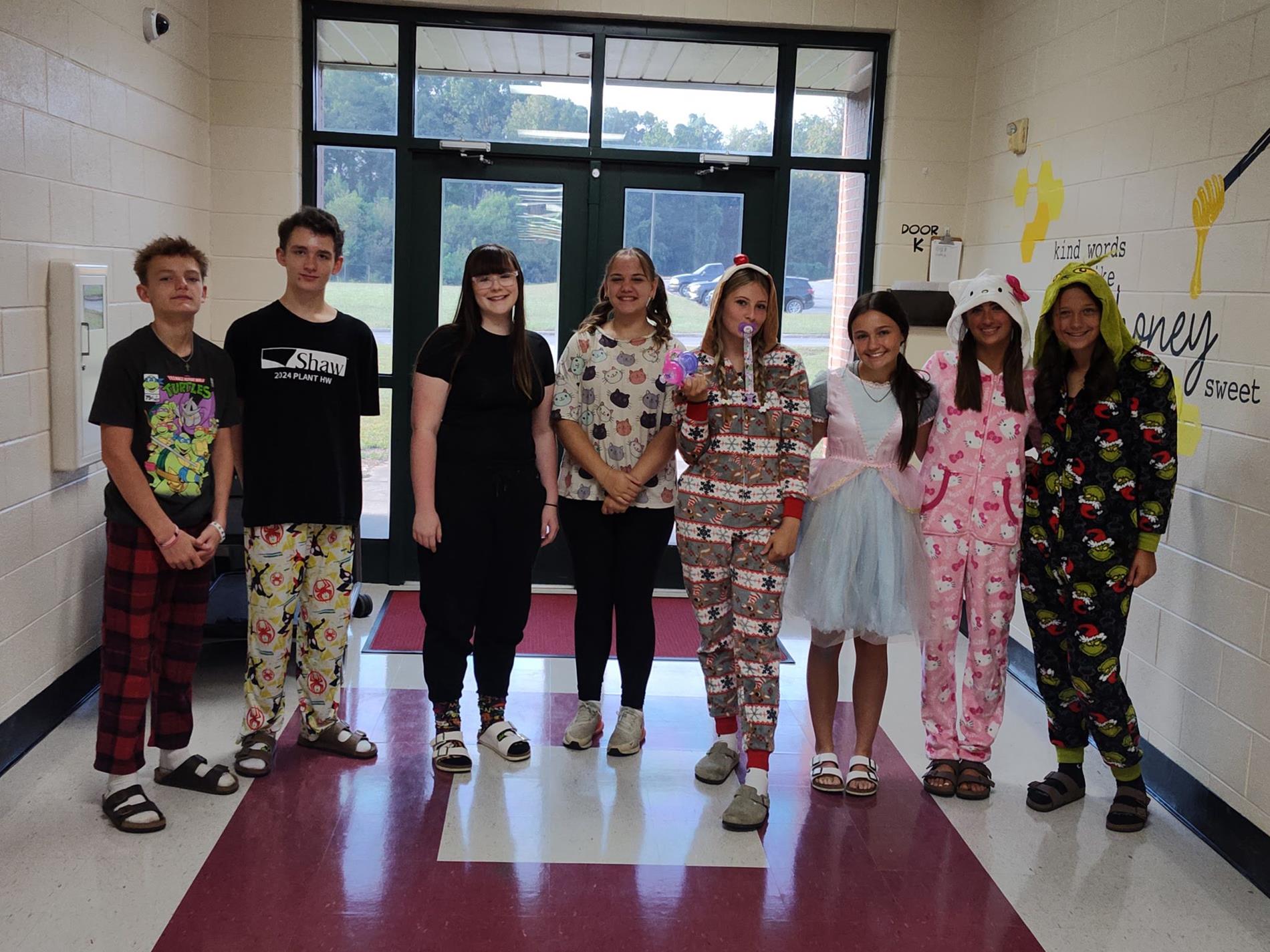 Group of students dressed in different pajamas being their "younger self" for homecoming.