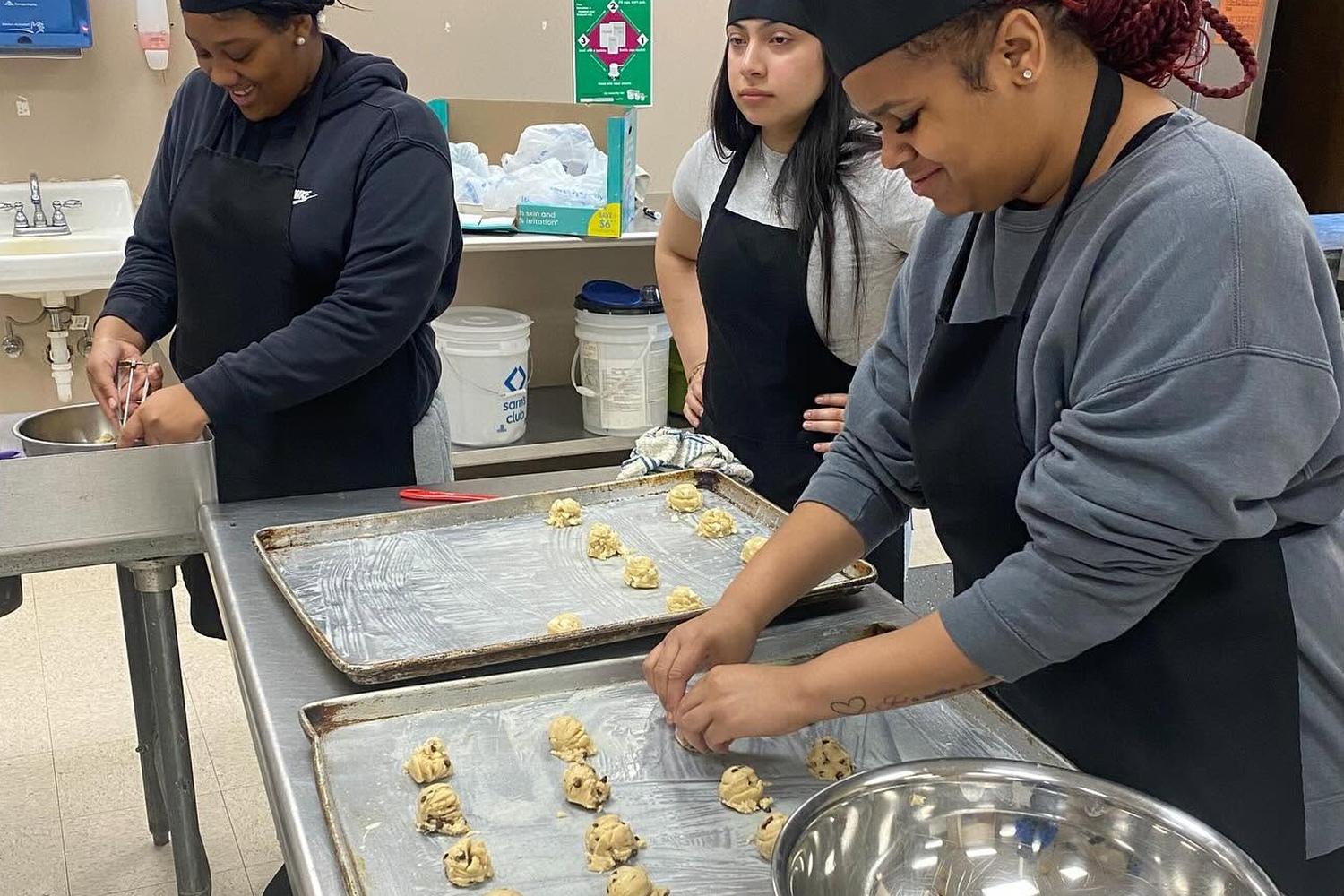 West Point Career and Technology Center Culinary Arts students preparing food during a hands-on class activity