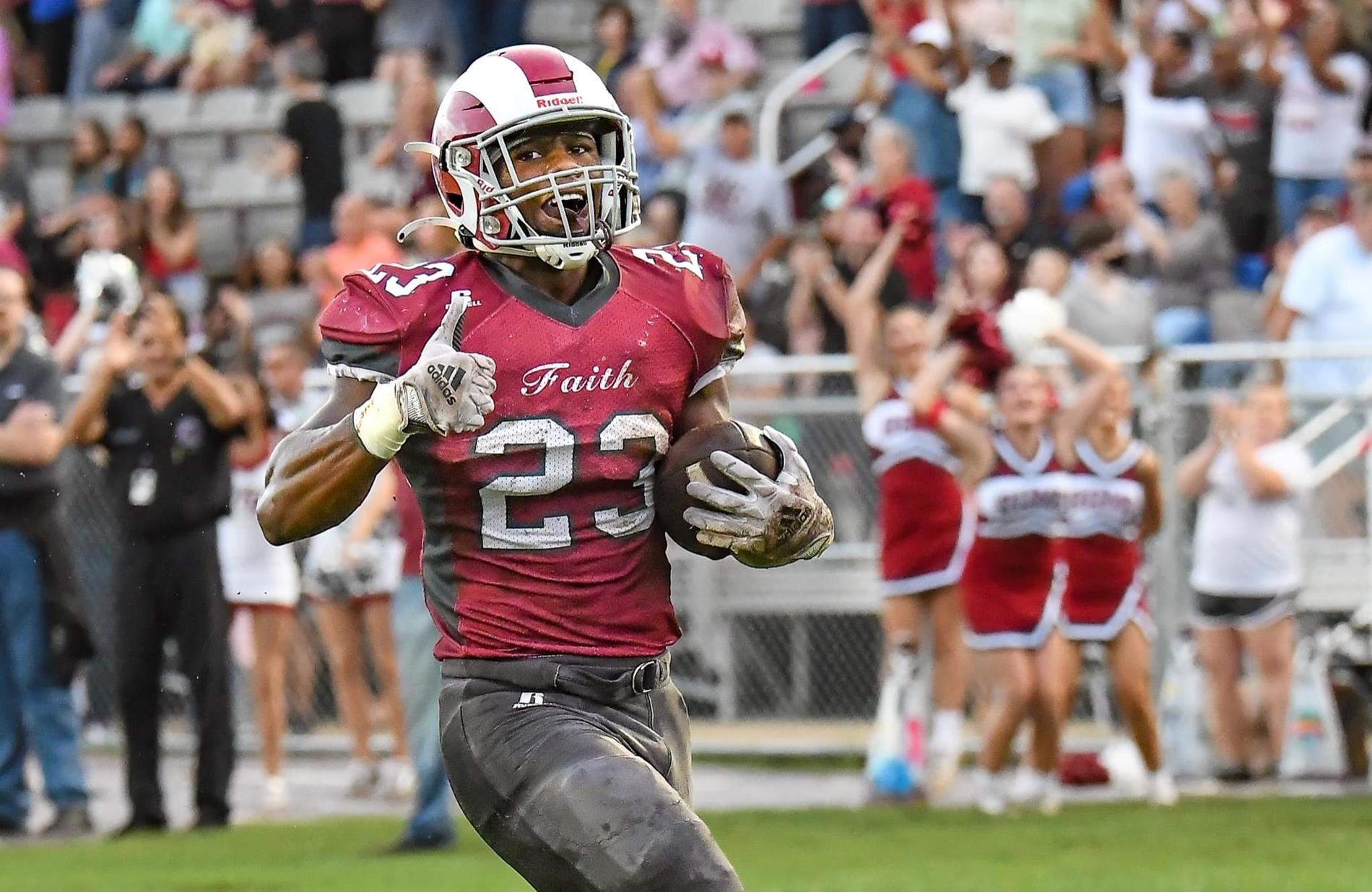 football player carrying ball