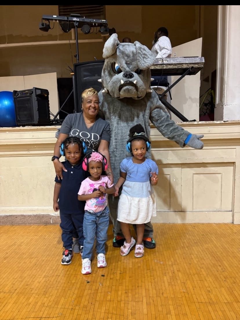 Preschoolers with school mascot