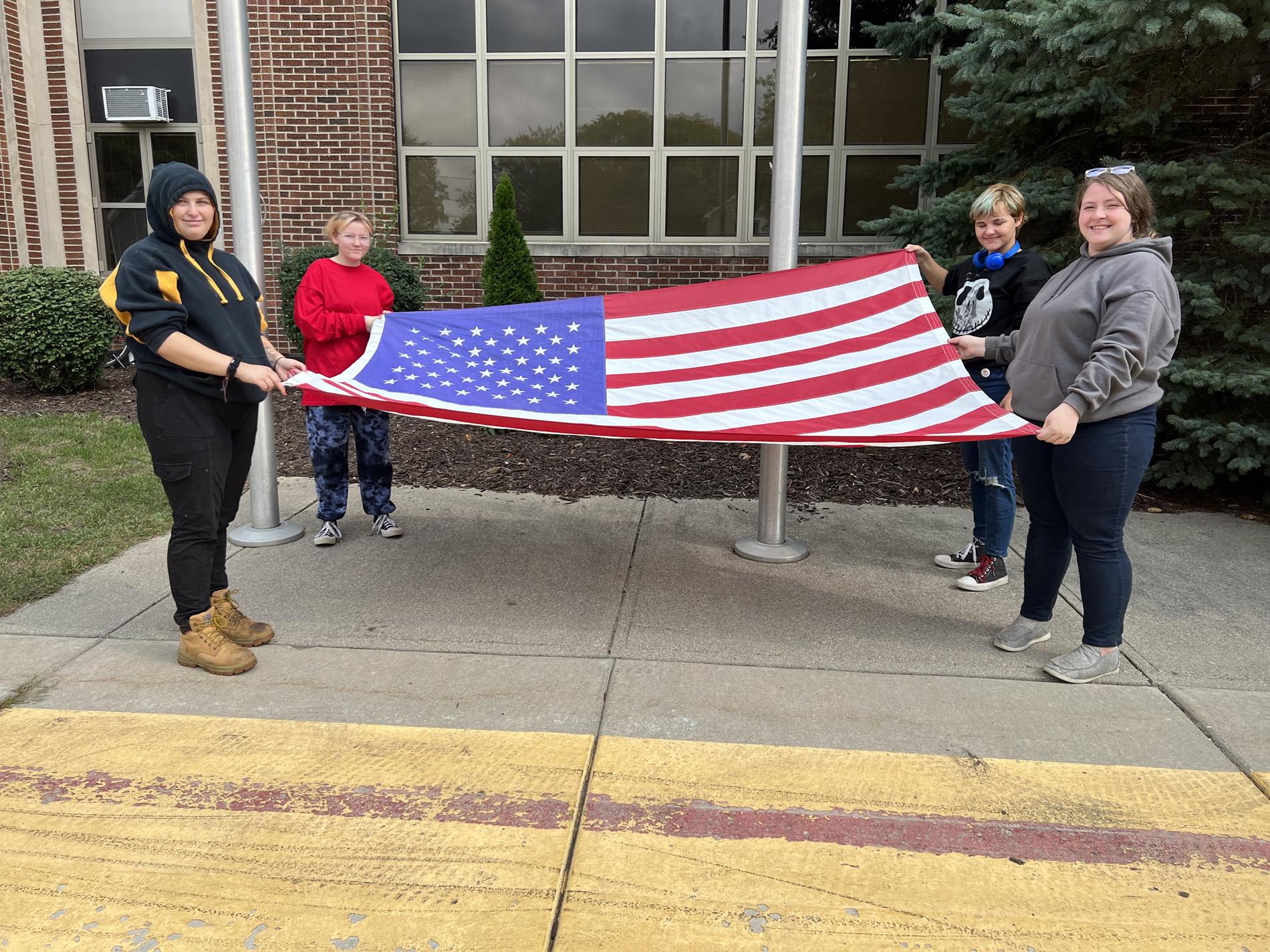 Students holding Flag