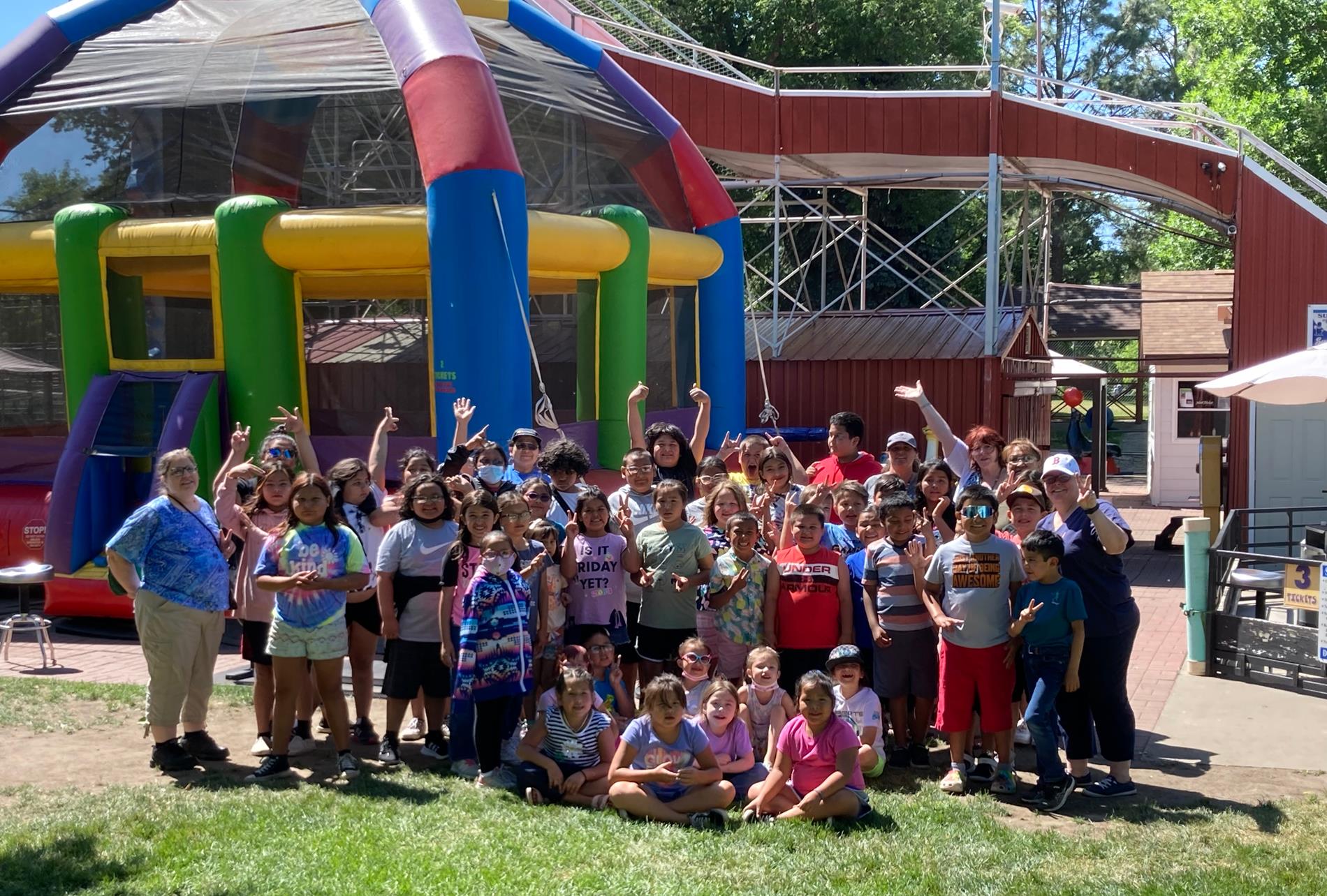 Group photo of staff and students at Super Slide Amusement Park