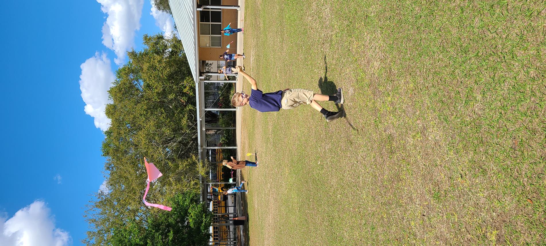 Mrs. Mercer's students flying a kite