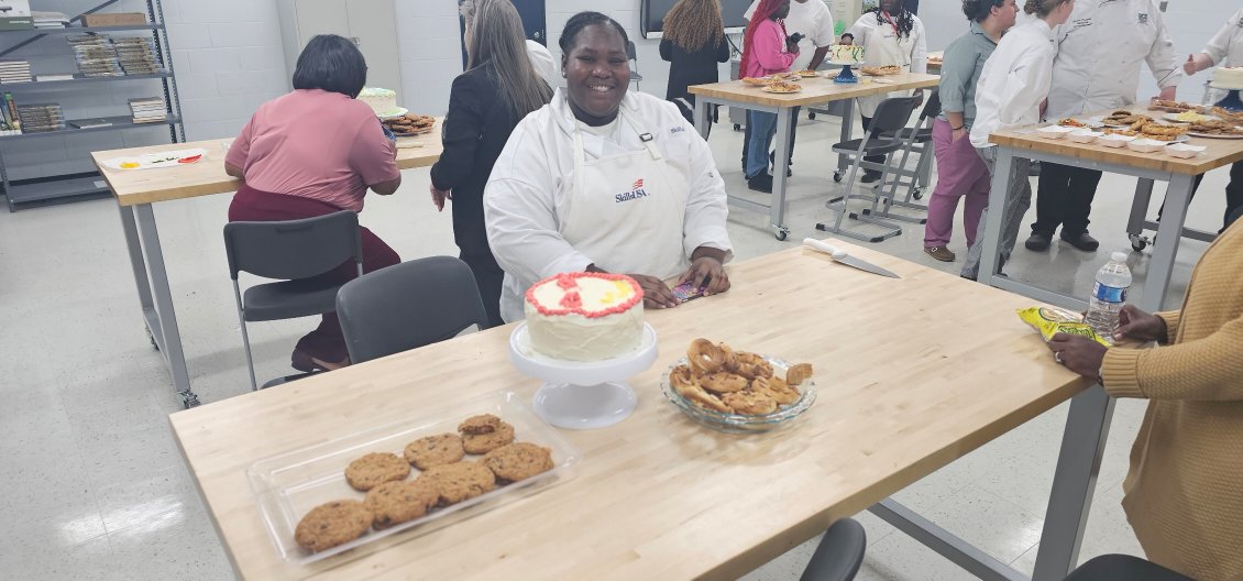 culinary arts student pictured with cake