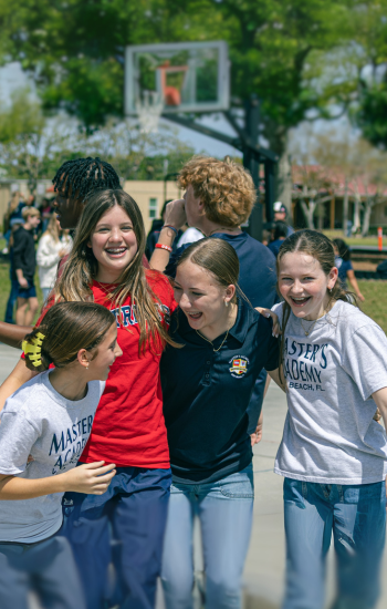 Upper school students smiling on court