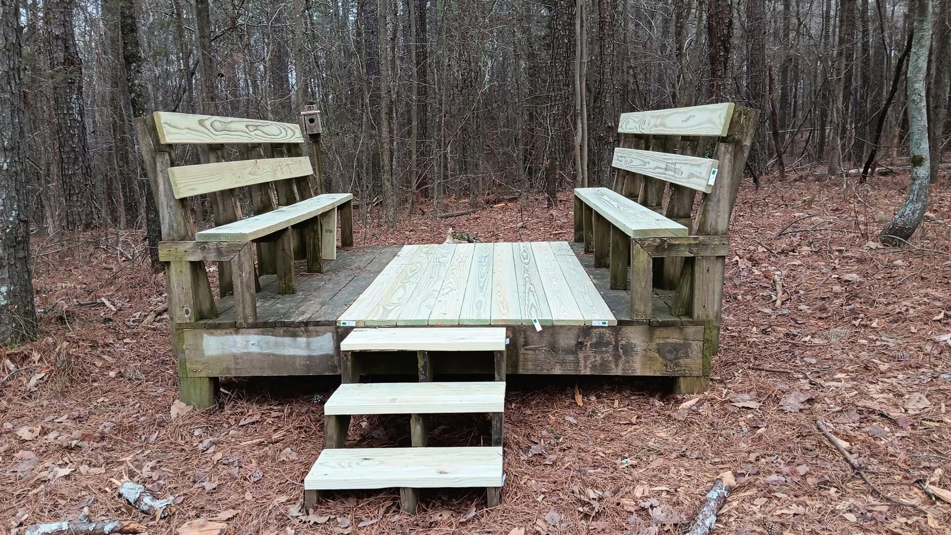 Outdoor Classroom with restored wood on another seating area