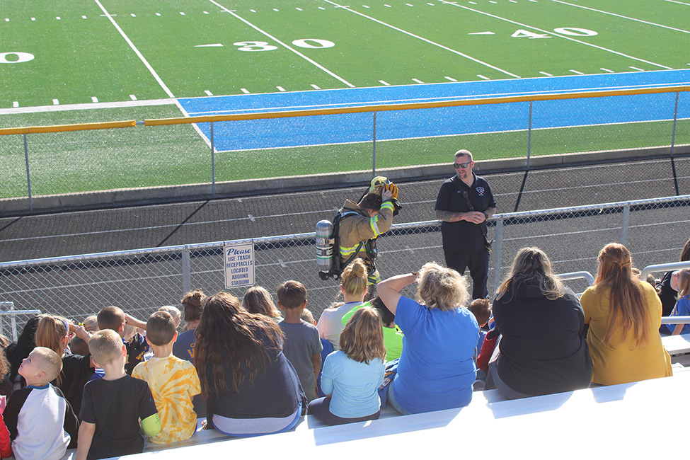 Chief Cole and junior fire fighter, Chase Utt demonstrate the equipment