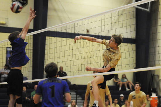 Saxony Lutheran Boys Volleyball - athlete spiking the ball