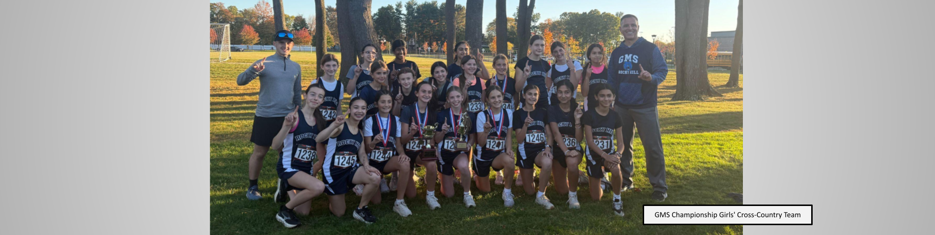 GMS girls cross country team posing for a championship photo!
