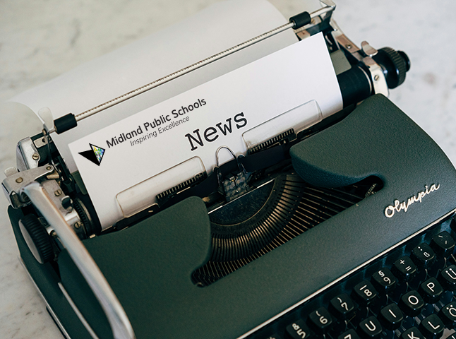A green typewriter with a paper in it that features the MPS logo and "news" at the top