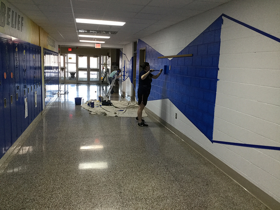 Staff painting the halls