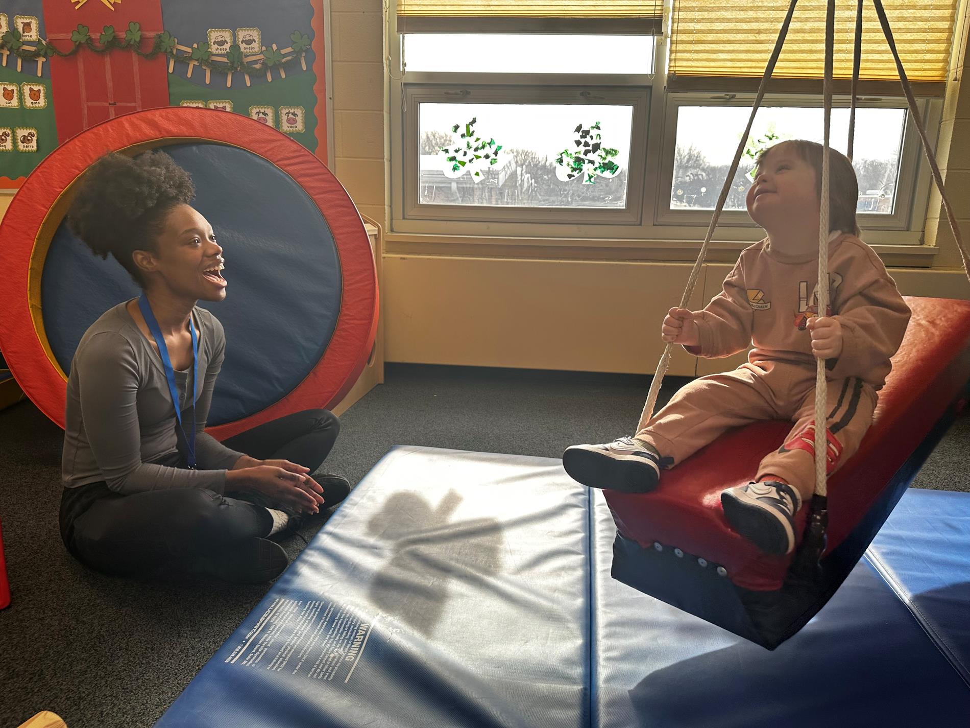 staff and student on swing
